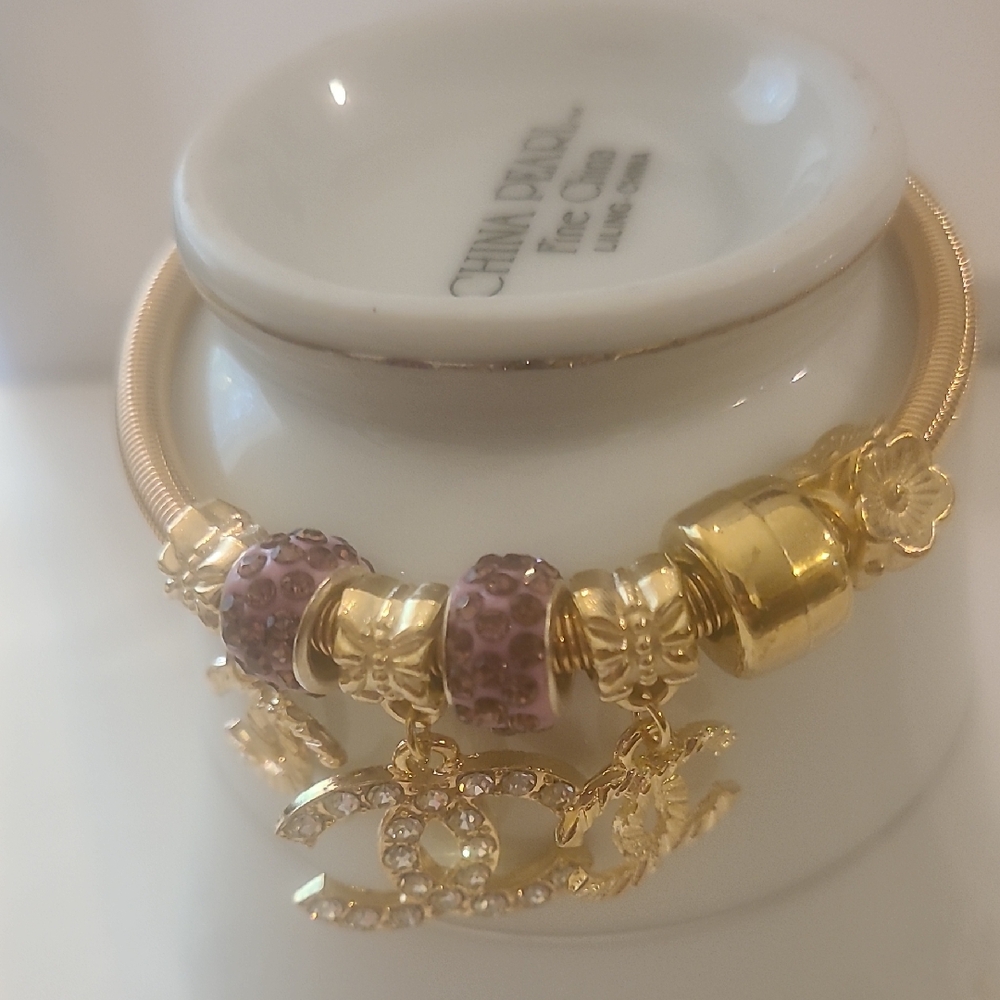 Goldtone and Purple Charm Bracelet